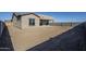 View of house exterior, showcasing backyard and landscaping at 18949 W Ocotillo Rd, Waddell, AZ 85355