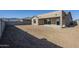 House exterior view showcasing backyard and patio at 18949 W Ocotillo Rd, Waddell, AZ 85355