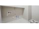 Laundry room features built-in shelving and hookups at 18949 W Ocotillo Rd, Waddell, AZ 85355