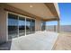 Covered patio with sliding glass doors at 18949 W Ocotillo Rd, Waddell, AZ 85355