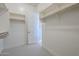 Spacious walk-in closet with ample shelving and hanging rods at 18949 W Ocotillo Rd, Waddell, AZ 85355