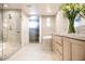 Bathroom featuring a glass-enclosed shower and dual vanity with modern fixtures at 2402 E Esplanade Ln # 601, Phoenix, AZ 85016