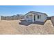 Expansive backyard with covered patio and block fence create a private outdoor space at 24620 W Hopi W St, Buckeye, AZ 85326