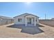 View of the home's backyard, featuring a covered patio and privacy fencing at 24620 W Hopi W St, Buckeye, AZ 85326