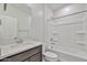 Well-lit bathroom featuring a vanity sink and a shower-tub combination at 24620 W Hopi W St, Buckeye, AZ 85326