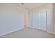 Bedroom featuring soft carpeting, closet, and adjoining room at 24620 W Hopi W St, Buckeye, AZ 85326