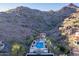 Aerial view of the community pool and desert landscape at 3800 E Lincoln Dr # 23, Phoenix, AZ 85018