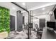 Finished basement space with unique architectural details, a custom desk, and plant wall at 3800 E Lincoln Dr # 23, Phoenix, AZ 85018