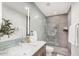 Elegant bathroom featuring modern tile, a glass-enclosed shower, and a sleek, well-lit vanity at 3800 E Lincoln Dr # 23, Phoenix, AZ 85018