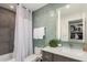Updated bathroom with green subway tile, modern vanity, and a shower-tub combination at 3800 E Lincoln Dr # 23, Phoenix, AZ 85018