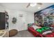 Fun bedroom featuring a car-shaped bed, basketball hoop, and a city-themed mural at 3800 E Lincoln Dr # 23, Phoenix, AZ 85018
