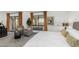 Bright bedroom suite featuring a balcony with views, sitting area, and calming neutral tones at 3800 E Lincoln Dr # 23, Phoenix, AZ 85018