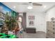 Bright bedroom featuring an accent wall with a mural, an easel and light carpet at 3800 E Lincoln Dr # 23, Phoenix, AZ 85018