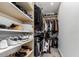 Organized walk-in closet with custom shelving and ample storage space at 3800 E Lincoln Dr # 23, Phoenix, AZ 85018