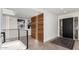 Modern entryway features a black front door with decorative glass and unique wood accent wall with lighting at 3800 E Lincoln Dr # 23, Phoenix, AZ 85018