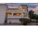 This hillside home features stucco siding, arched windows, and an elevated perch with views at 3800 E Lincoln Dr # 23, Phoenix, AZ 85018