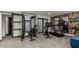 Home gym featuring exercise equipment, mirrors, and unique graffiti art at 3800 E Lincoln Dr # 23, Phoenix, AZ 85018