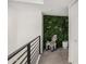 Hallway with zebra statue next to a green plant wall at 3800 E Lincoln Dr # 23, Phoenix, AZ 85018