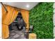 Home theater entrance with elegant curtains, plant wall and comfortable seating at 3800 E Lincoln Dr # 23, Phoenix, AZ 85018