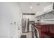 Well-appointed laundry room with modern appliances, ample storage, and stylish tile flooring at 3800 E Lincoln Dr # 23, Phoenix, AZ 85018