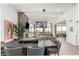 Open-concept living area features a cozy fireplace, high ceilings, and seamless integration with the dining space at 3800 E Lincoln Dr # 23, Phoenix, AZ 85018