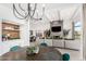 Stylish living space with dining and kitchen views, highlighted by a stone fireplace and an open layout at 3800 E Lincoln Dr # 23, Phoenix, AZ 85018