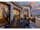 Charming outdoor patio with dining and lounge areas, seamlessly connecting indoor and outdoor living spaces at 3800 E Lincoln Dr # 23, Phoenix, AZ 85018