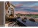 Outdoor patio features a dining area and comfortable seating with a fire pit, perfect for enjoying the sunset views at 3800 E Lincoln Dr # 23, Phoenix, AZ 85018