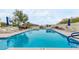 Community pool offers lounge furniture and desert mountain views at 3800 E Lincoln Dr # 23, Phoenix, AZ 85018