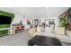 Open recreation room with gym, built-in shelving, and a comfortable seating area at 3800 E Lincoln Dr # 23, Phoenix, AZ 85018