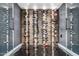 Contemporary wine cellar featuring climate control, custom racks and stylish design at 3800 E Lincoln Dr # 23, Phoenix, AZ 85018