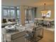 Bright living area with large windows, stylish decor, and an adjacent dining space at 4739 N Scottsdale Rd # 2002, Scottsdale, AZ 85251