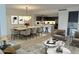Open-concept living room with a dining area, sleek kitchen, and comfortable seating arrangements at 4739 N Scottsdale Rd # 2002, Scottsdale, AZ 85251