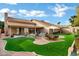 Spacious backyard with patio, artificial turf and room for outdoor dining at 9478 E Corrine Dr, Scottsdale, AZ 85260