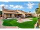 Large backyard with covered patio, artificial turf and plenty of space at 9478 E Corrine Dr, Scottsdale, AZ 85260