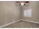 Bright bedroom with ceiling fan and window shutters at 9478 E Corrine Dr, Scottsdale, AZ 85260