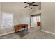 Bedroom with ceiling fan and wood desk at 9478 E Corrine Dr, Scottsdale, AZ 85260