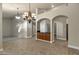 Bright dining room features tile floors and a built-in wet bar at 9478 E Corrine Dr, Scottsdale, AZ 85260