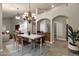 Modern dining room with a large wooden table and leather chairs at 9478 E Corrine Dr, Scottsdale, AZ 85260