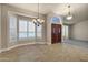 Dining area with tiled floor, chandelier, and window seat at 9478 E Corrine Dr, Scottsdale, AZ 85260