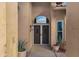 Double doors with screen doors leading into the home at 9478 E Corrine Dr, Scottsdale, AZ 85260