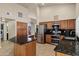 Updated kitchen with stainless steel appliances and granite countertops at 9478 E Corrine Dr, Scottsdale, AZ 85260