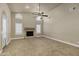 Spacious living room featuring a fireplace and high ceilings at 9478 E Corrine Dr, Scottsdale, AZ 85260