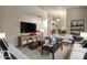 Living room with fireplace and built-in shelving at 9478 E Corrine Dr, Scottsdale, AZ 85260