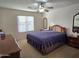 Spacious bedroom with a large bed and window coverings at 2101 S Meridian Rd # 205, Apache Junction, AZ 85120