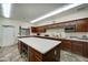 Modern community kitchen with island and ample cabinetry at 2101 S Meridian Rd # 205, Apache Junction, AZ 85120