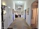 Bright entryway with view of living room and hallway at 2101 S Meridian Rd # 205, Apache Junction, AZ 85120