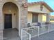 Covered front porch with stone facade and wrought-iron railing at 2101 S Meridian Rd # 205, Apache Junction, AZ 85120
