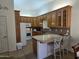 Kitchen with wood cabinets and granite countertops at 2101 S Meridian Rd # 205, Apache Junction, AZ 85120