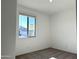 Simple bedroom with neutral walls, carpet, and window with blinds at 24126 W Sunland Ave, Buckeye, AZ 85326